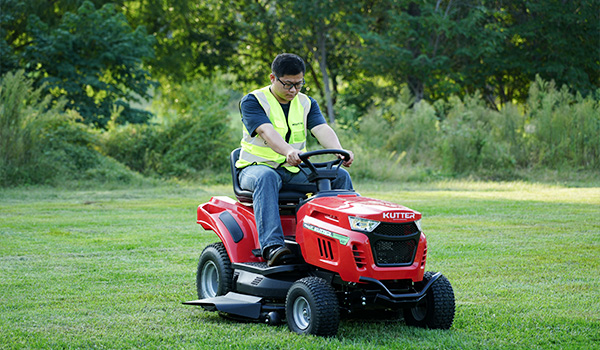 kutter-lawn-mowing-equipment-red-lawn-tractor-cutting-grass.jpg